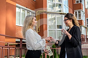 Shaking hands between sales agent and buyer