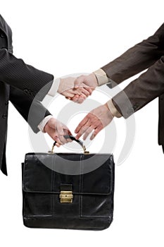 Shaking hands and transfer briefcase