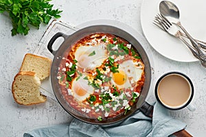 Shakshouka, eggs poached in sauce of tomatoes, olive oil. Mediterranean cousine