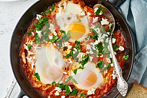 Shakshouka, eggs poached in sauce of tomatoes, olive oil. Mediterranean cousine