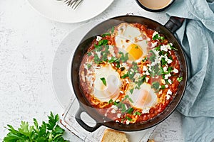 Shakshouka, eggs poached in sauce of tomatoes, olive oil. Mediterranean cousine