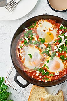 Shakshouka, eggs poached in sauce of tomatoes, olive oil. Mediterranean cousine