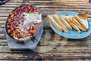 Shakshuka in a bowl on a table