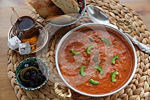 Shakshuka with eggs, tomato in a cast copper pan