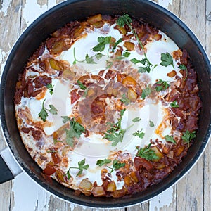 Shakshuka an Egyptian made from tomatoes, peppers and poached eggs