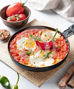 Shakshuka, fried eggs with vegetables