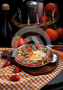 Shakshuka with tomatoes and eggs