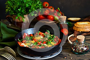 Shakshuka is a traditional breakfast of Israeli cuisine. Eggs fr