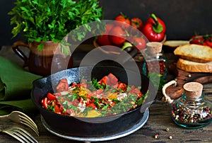 Shakshuka is a traditional breakfast of Israeli cuisine. Eggs fr