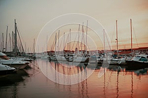 There are many yachts, boats and ships at sea. Marina at sunset. Vosice Croatia Gorgeous summer sunset by the ocean