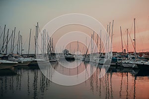 There are many yachts, boats and ships at sea. Marina at sunset. Vosice Croatia Gorgeous summer sunset by the ocean