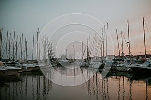 There are many yachts, boats and ships at sea. Marina at sunset. Vosice Croatia Gorgeous summer sunset by the ocean