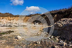 Shallow abandoned limestone quarry, construction material extraction