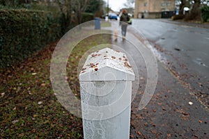 Shallow cows of a newly installed Internet telecoms street cabinet in a village setting.