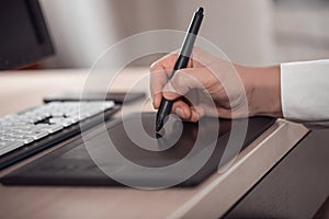 Shallow depth of field closeup of a graphic designer's workspace