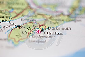 Shallow depth of field focus on geographical map location of Halifax Canada America continent on atlas