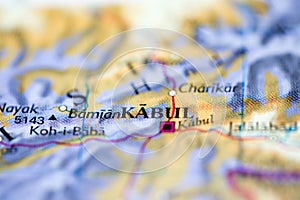 Shallow depth of field focus on geographical map location of Kabul Afghanistan Asia continent on atlas