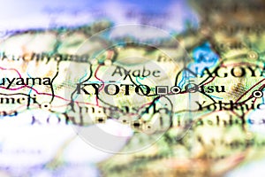 Shallow depth of field focus on geographical map location of Kyoto city in Honshu Island Japan Asia continent on atlas