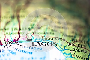 Shallow depth of field focus on geographical map location of Lagos city in Nigeria Africa continent on atlas