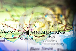 Shallow depth of field focus on geographical map location of Melbourne city in Australia Australasia continent on atlas