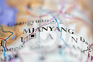 Shallow depth of field focus on geographical map location of Mianyang city China Asia continent on atlas