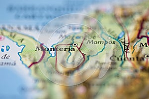 Shallow depth of field focus on geographical map location of Monteria city Colombia South America continent on atlas photo
