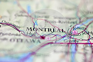 Shallow depth of field focus on geographical map location of Montreal Canada America continent on atlas