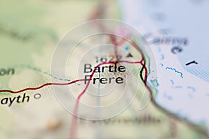 Shallow depth of field focus on geographical map location of Mount Bartle Frere in Australia Ocenia continent on atlas