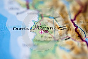 Shallow depth of field focus on geographical map location of Tirane Tirana city Albania Europe continent on atlas