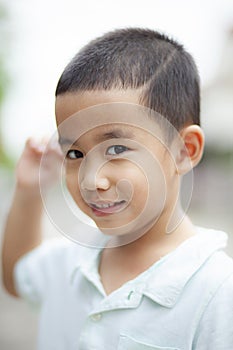 Shallow depth of field photography of lovely asian boy toothy sm