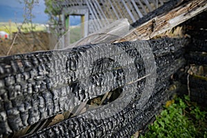 Shallow depth of field selective focus details with burned wood from a burnt house