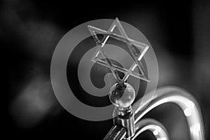 Shallow depth of field selective focus details with a metal star of David decoration inside a synagogue