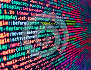 Shallow depth of field, selective focus effect. Css3 code on a colorful background. Background of software developer script.