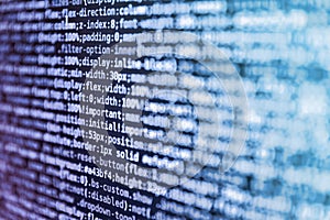 Shallow depth of field, selective focus effect. Programming code abstract technology background of software developer and Computer
