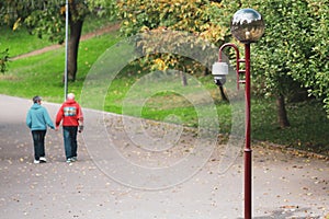 Shallow depth of field selective focus image with a cctv security video camera on a pole in a public park