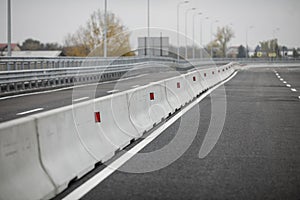 Shallow depth of field selective focus image with concrete Jersey barriers Jersey walls or Jersey bumps on a highway