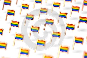 Shallow DOF focus on Rainbow LGBTQ flags group. Gay pride month symbol concept.  on white background. 3D rendering