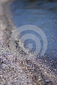 Shallow DOF on sand and sea photo