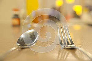 Shallow DOF of silver ware on table