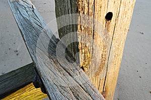 Shallow focus of a flat wooden beam seen on an old jetty.