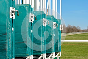 Shallow focus of horse racing turnstiles seen from the rear gates.