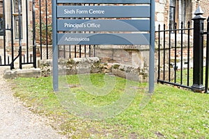 Shallow focus of the information sign to a private sixth form college and admissions office.