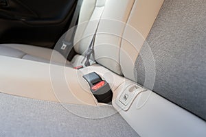 Shallow focus of the Isofix child safety attachment system seen on the rear seats of a new technology, hybrid car. photo