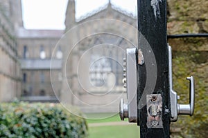 Shallow focus of an opened park door showing a combination lock.