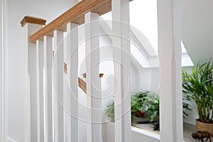 Shallow focus of the wooden texture of a first floor stairwell.