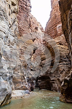 The shallow Mujib River flows along a tourist route in the Mujib River Canyon in Wadi Al Mujib in Jordan