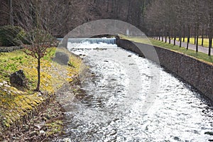 Shallow river with a low waterfall