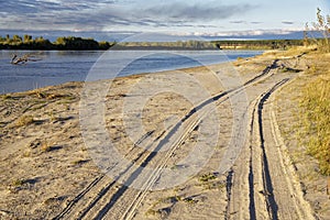 Sunset lighting of the autumn river bank in Siberia