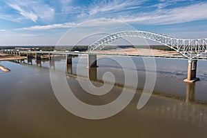 Shallow water of Mississippi river under Memphis bridge in October 2023