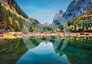 Shallow waters of Gosausee Vorderer lake with Dachstein glacier on background. Bright autumn scene of Austrian Alps, Upper Austr